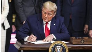 Trump signs order to remove US from WHO.